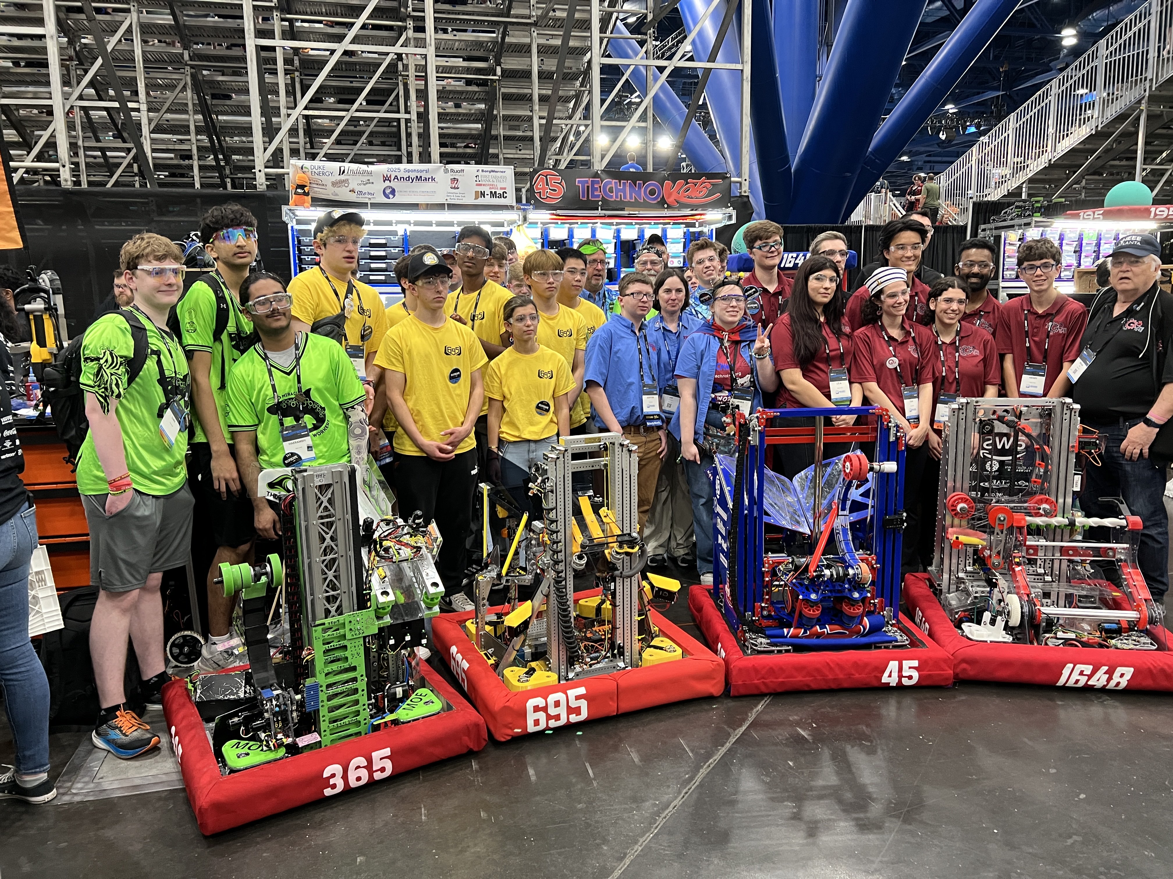 TechnoKats and fellow teams with robots at the 2026 championship